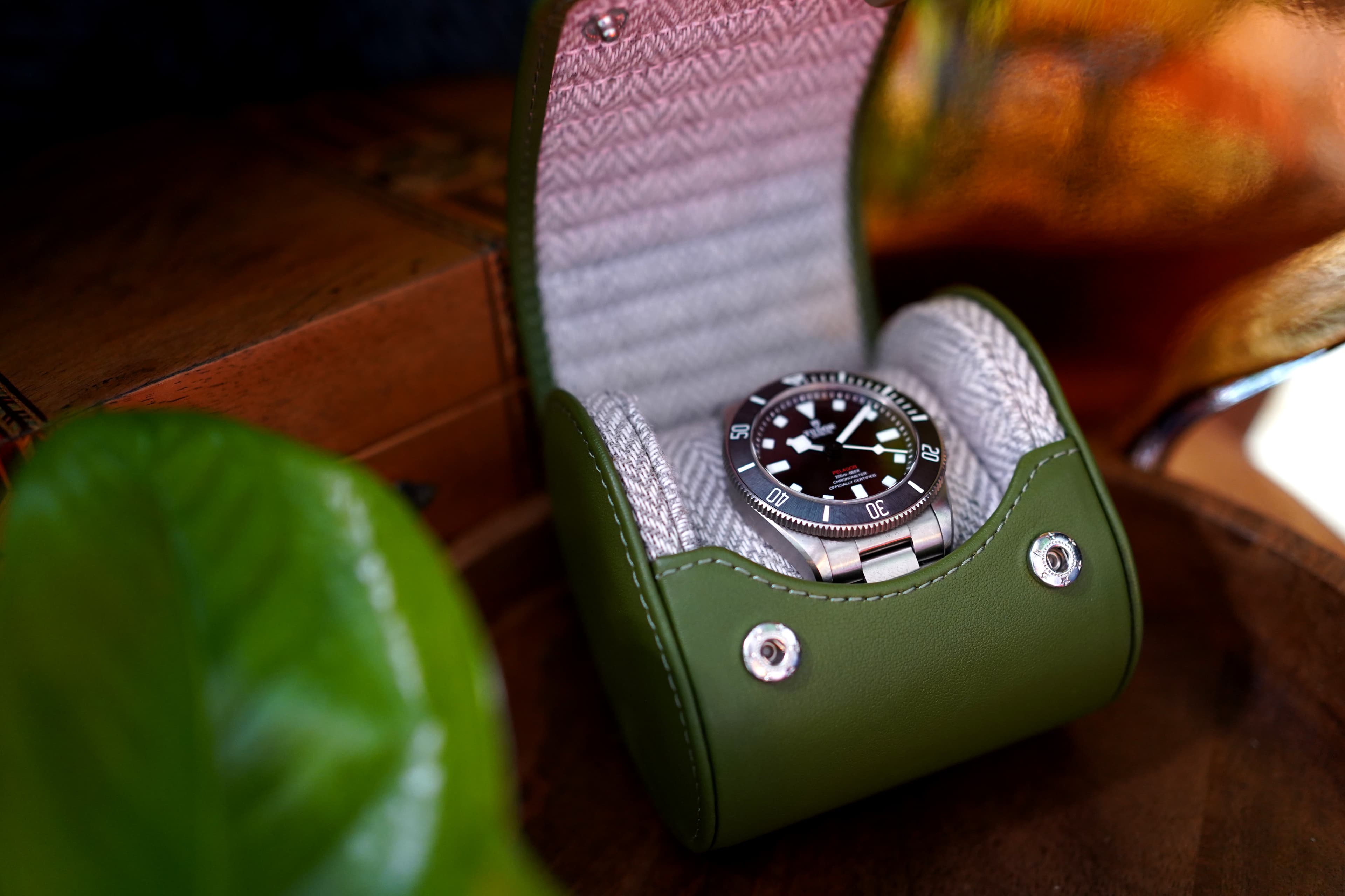 Introducing the Evergreen Luxury Watch Travel Roll – where timeless elegance meets impeccable craftsmanship. This exceptional case showcases a striking Green Leather exterior paired with a sophisticated Grey and White Chevron Patterned Interior, perfectly blending style and security for your cherished timepieces.
In this unique setting, envision our Evergreen case resting gracefully inside a cozy glamping teepee, surrounded by the rustic charm of the great outdoors. The lush green leather exterior embodies luxury, while the chevron patterned interior adds a touch of modern sophistication. Whether you're on a glamping adventure or simply seeking to protect your watches with utmost care, the Evergreen Luxury Watch Travel Roll is your ideal companion.
Explore a world where your watches travel in impeccable style, whether under the stars or in the comfort of your teepee, safe in the knowledge that every detail has been considered. Discover the essence of luxury and protection with our Evergreen case, redefining watch storage for the modern adventurer.